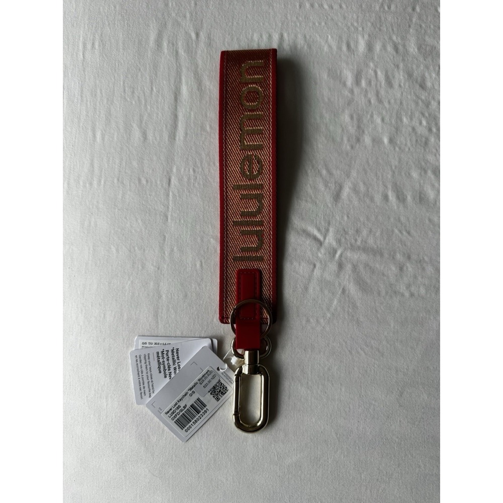 NWT Lunar New Year Never Lost Keychain Metallic Wordmark Red Gold